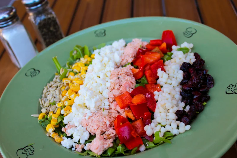 A vibrant salad featuring fresh vegetables and seeds, perfect for a healthy meal.