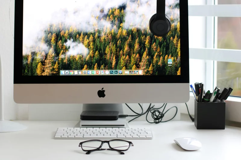 Stylish home office workspace featuring a computer setup with accessories.