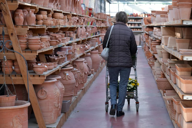 A woman shops for terracotta pots in a pottery store in Rizza, Italy.