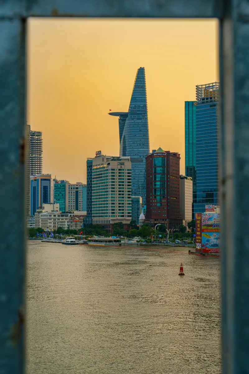 A stunning view of Ho Chi Minh City's skyline with the Bitexco Financial Tower at sunset.