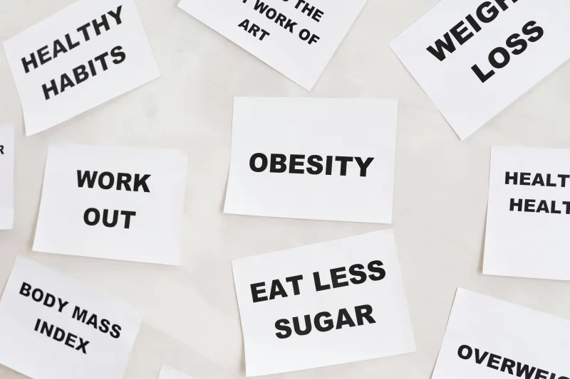 Conceptual image featuring motivational cards on health, fitness, and wellness on a white background.