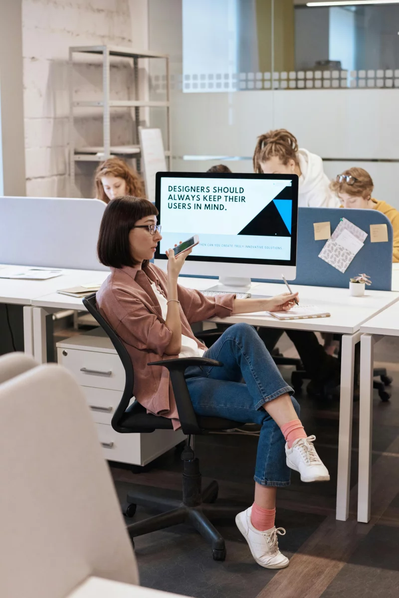 Creative professionals working collaboratively in a modern office space.