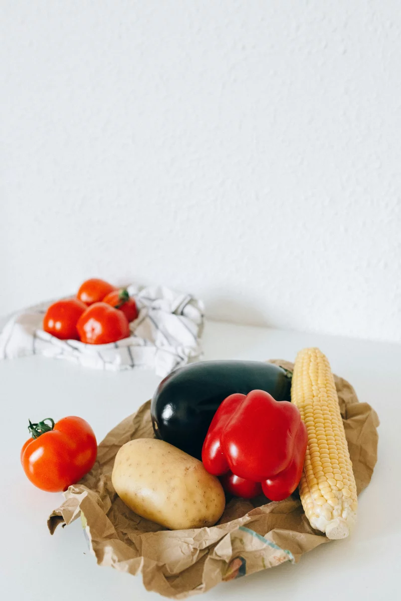 Colorful fresh vegetables on a kitchen table ready for healthy meal preparation.