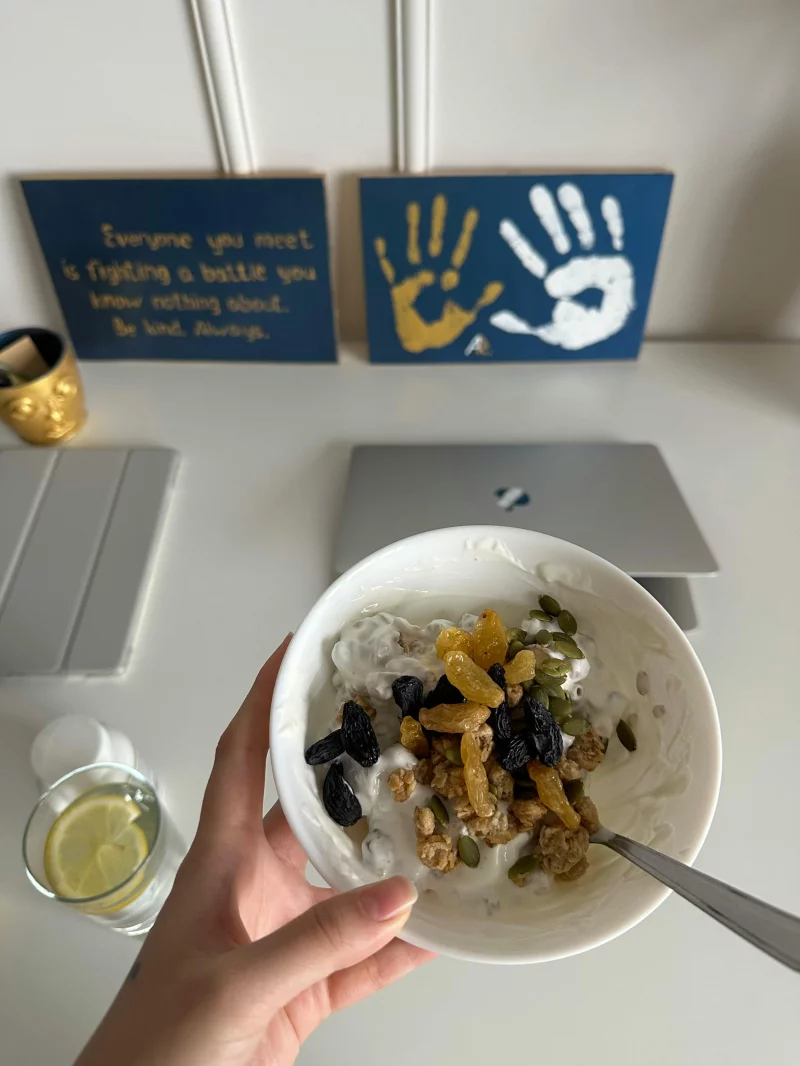 Yogurt bowl with muesli, seeds, and nuts as a healthy office snack.