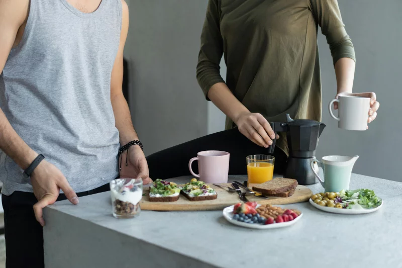 Cozy morning breakfast with avocado toast, coffee, and fresh juice.