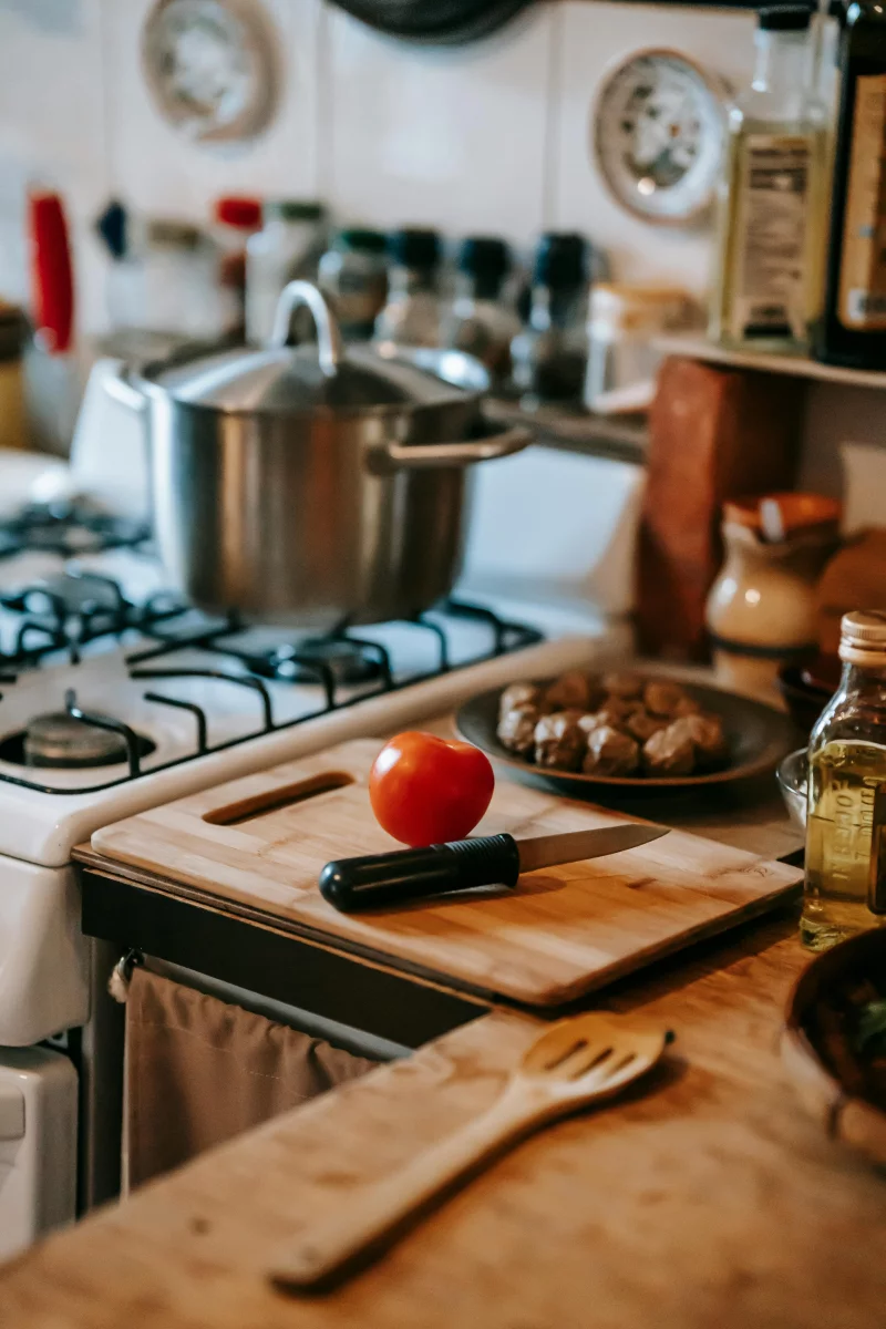 A charming kitchen setting showcasing fresh ingredients and utensils ready for cooking.