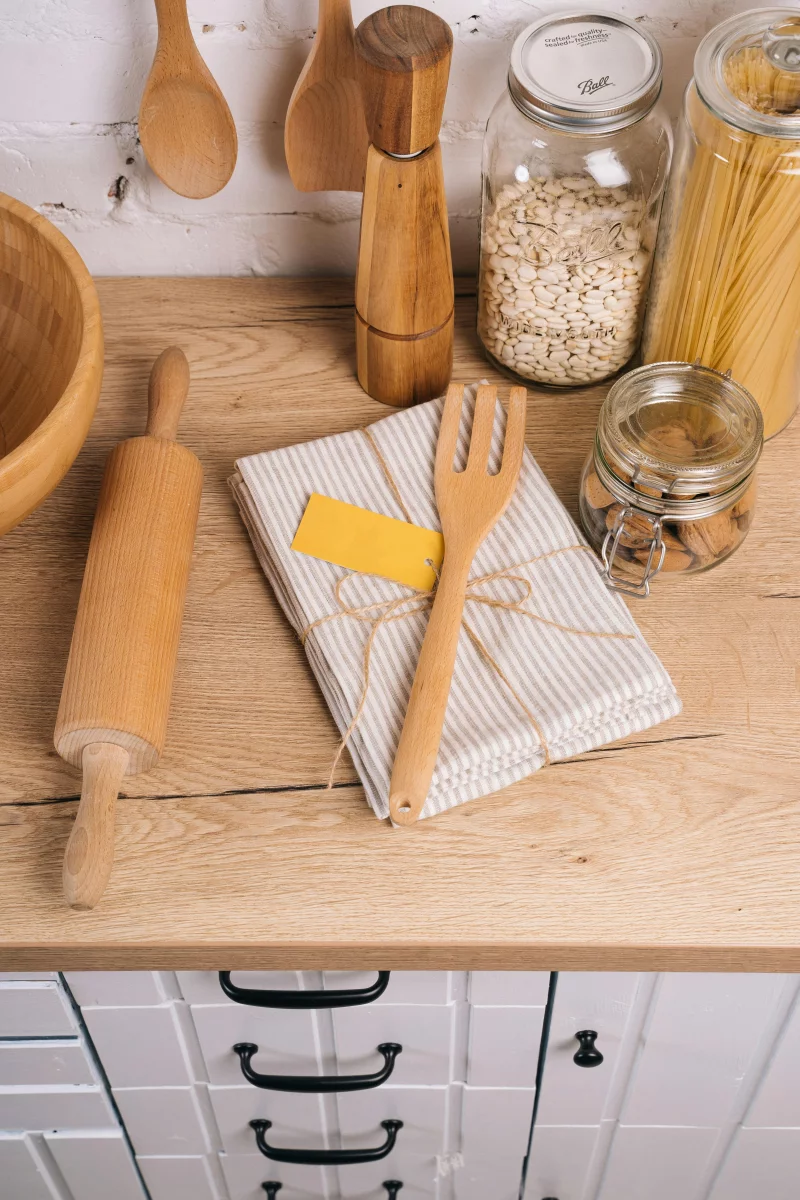 Cozy kitchen setup with wooden utensils and pantry staples.