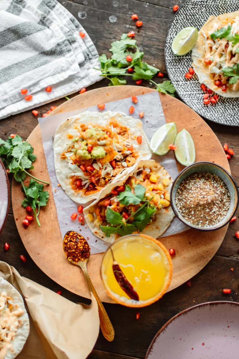 Top view of appetizing Mexican tacos with fresh ingredients and spices, perfect for food lovers.