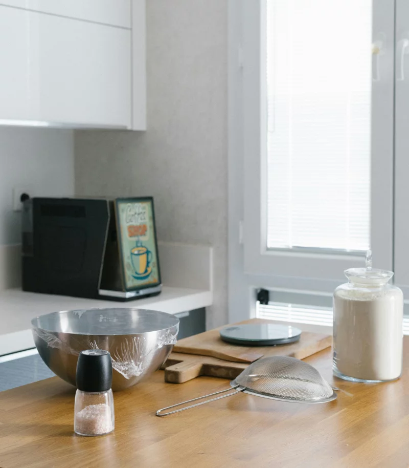 A clean and modern kitchen setup with cooking essentials for stylish home cooking.