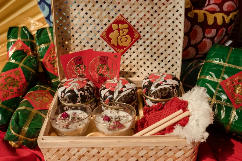 A vibrant display of a traditional Tet gift basket with food and ornaments, perfect for cultural celebrations.