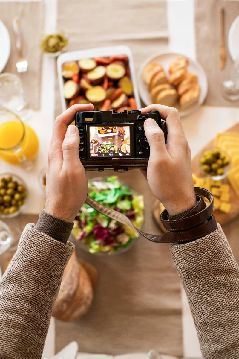Top-down view of a colorful breakfast spread captured through a camera lens.