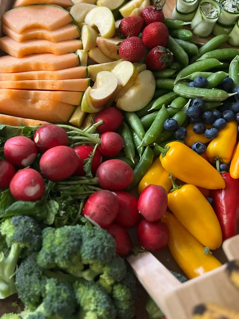 A vibrant assortment of fresh fruits and vegetables focusing on nutrition and health.