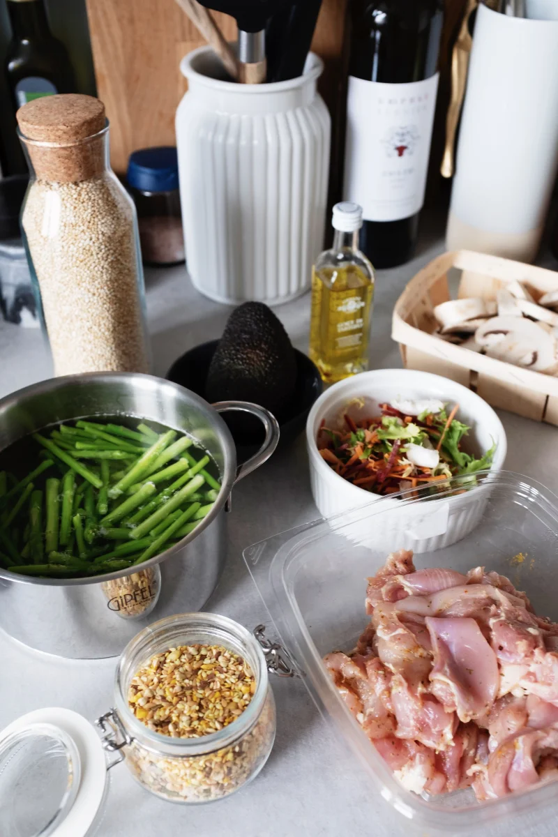 Various fresh ingredients for cooking in a home kitchen setting.