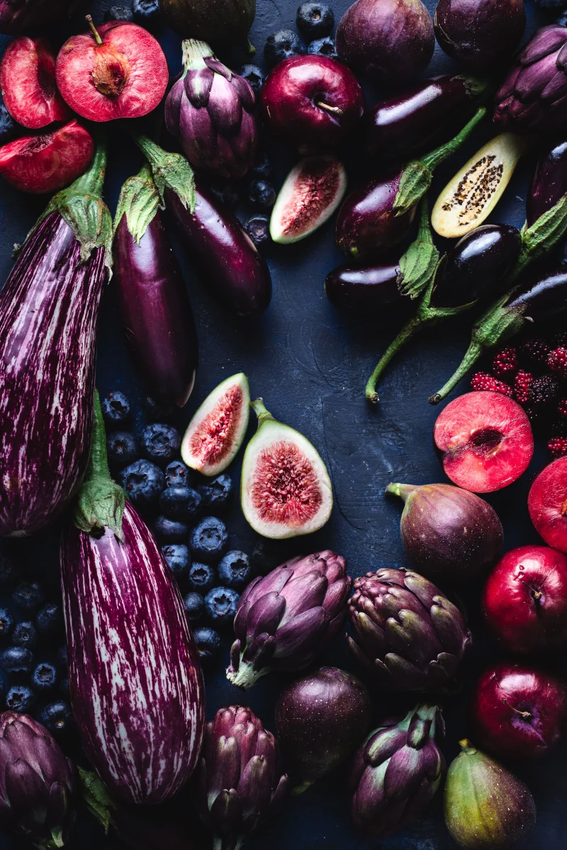 A stunning display of colorful fruits and vegetables highlighting natural textures and freshness in a still life composition.