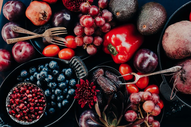 Colorful assortment of fresh fruits and vegetables in a flat lay arrangement, perfect for healthy lifestyle themes.