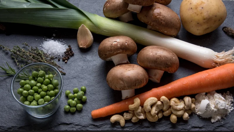 Top view of fresh vegetables and ingredients for healthy cooking.