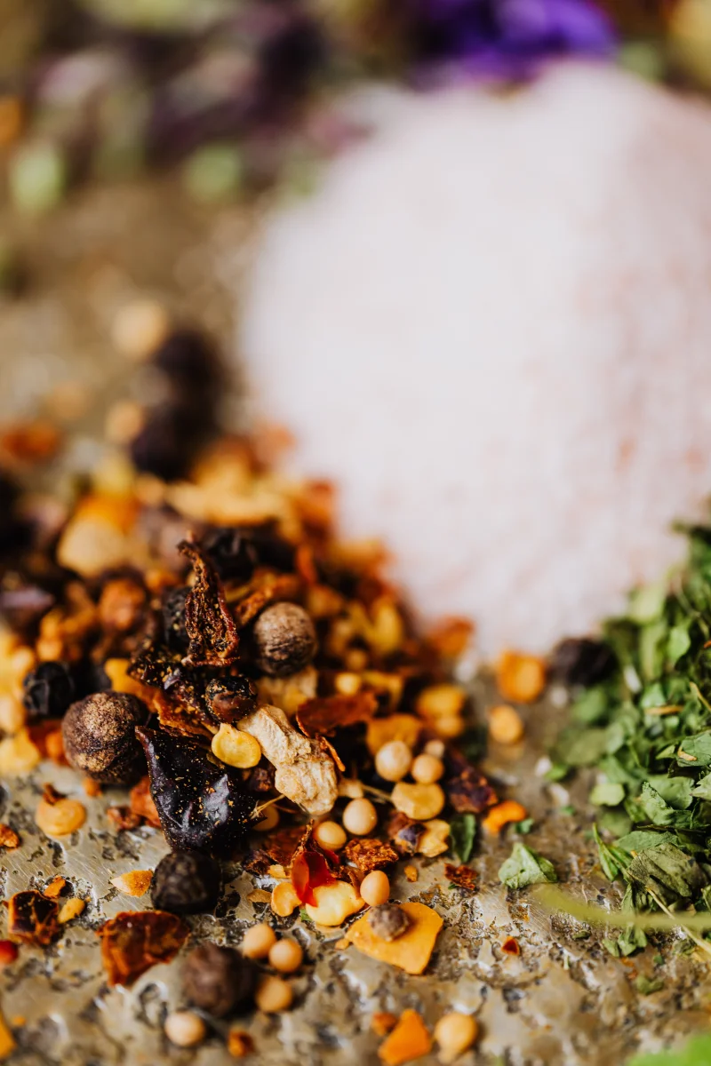 Close-up of a vibrant assortment of spices and herbs, showcasing culinary diversity.