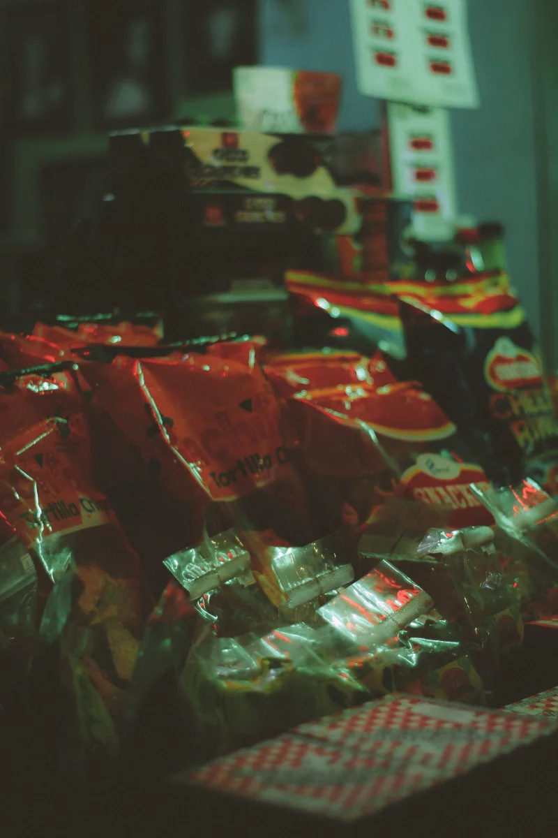 A variety of snack bags displayed on a store shelf, highlighting consumer choices.